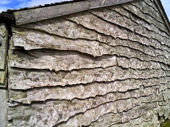 Photo 6"x4" Waney edge boards on shed at Lone Achfary c2008