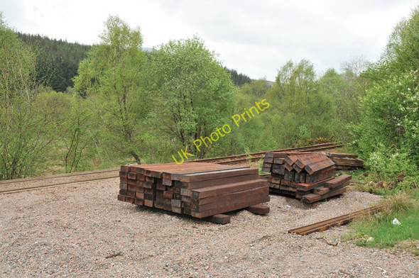 Photo 6"x4" Sleepers stacked next to the West Highland line Achluachrach c2010