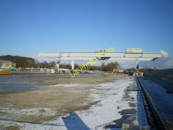 Photo 6"x4" An empty stockyard and a travelling crane Mugginton c2010