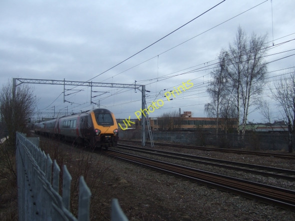 Photo 6"x4" Train alongside Birmingham-Wolverhampton canal Gib Heath c2010