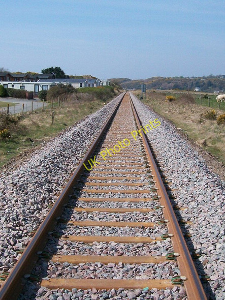Photo 6"x4" The single track Cambrian Coast line west of the Abererch Sands crossing Pwllheli c2010