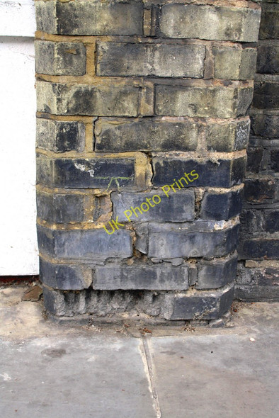 Photo 6"x4" Damaged benchmark on wall of Roebuck House, St Marks Road Kensal Town c2011