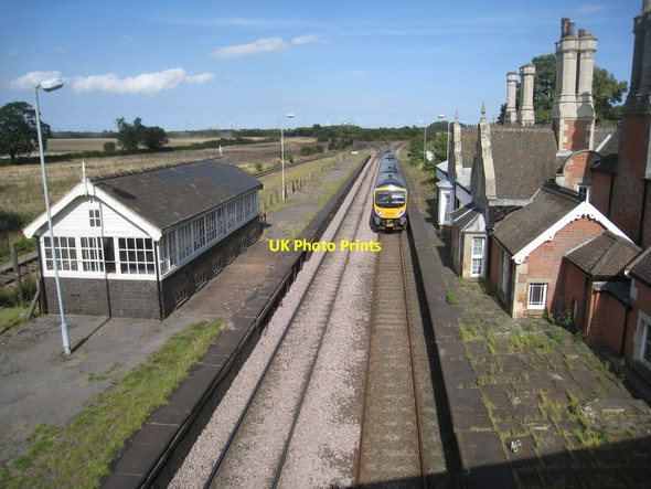Photo 6"x4" A Cleethorpes to Manchester Airport Train passes through the former Brocklesby Station Ulceby\/TA1014 c2011