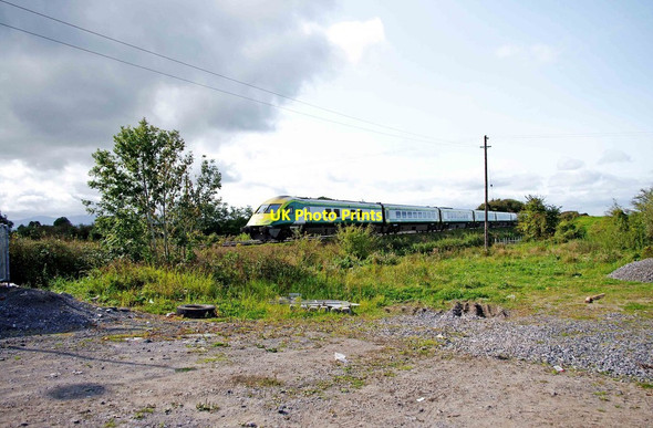 Photo 6"x4" Intercity train approaching level crossing on the R497 near Donohill Donohill c2011