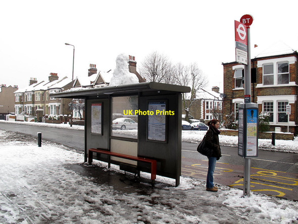 Photo 6"x4" Snowman waiting for a bus Greenwich\/TQ3977 c2012