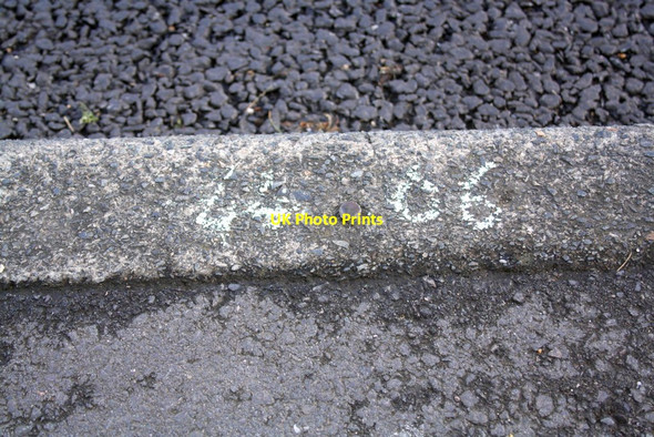 Photo 6"x4" Benchmark  on kerb outside #65 Newmans Lane Loughton\/TQ4396 c2012