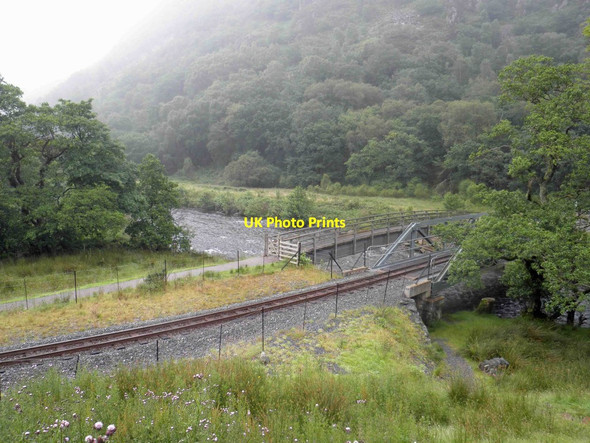 Photo 6"x4" Footbridge and narrow gauge railway line crossing the river (Afon Glasyn) near Beddgelert Beddgelert c2012