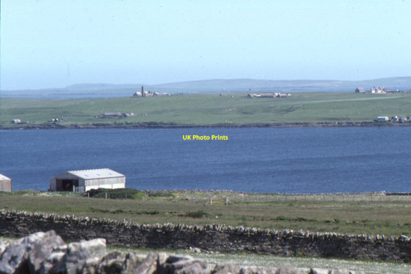 Photo 6"x4" Egilsay and St Magnus's church, seen from Rousay Sourin c1995