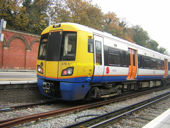 Photo 6"x4" London Overground train with remembrance poppy Penge c2012