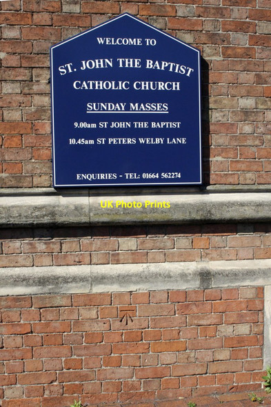 Photo 6"x4" Noticeboard and benchmark on St John the Baptist Church Melton Mowbray c2012