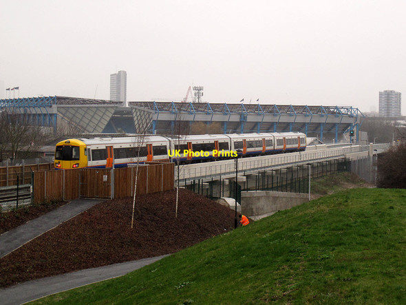 Photo 6"x4" Train passing the site of a future new station Deptford\/TQ3677 c2013