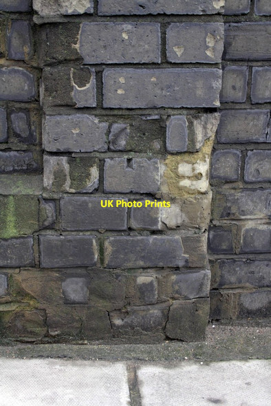 Photo 6"x4" Damaged benchmark on wall post of #16 Vicarage Gardens Kensington\/TQ2579 c2013