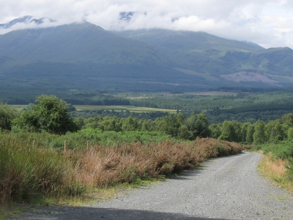 Photo 6"x4" View down track: Aonach Mor and Beag with snow patches behind cloud Inverroy c2008