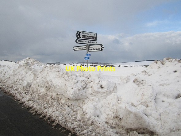 Photo 6"x4" Road sign and snow drifts Abbey St Bathans c2013