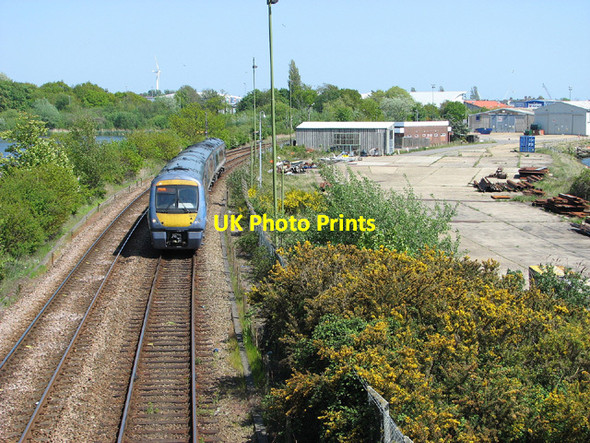 Photo 6"x4" Diesel multiple unit past industrial units by Lake Lothing Lowestoft c2013
