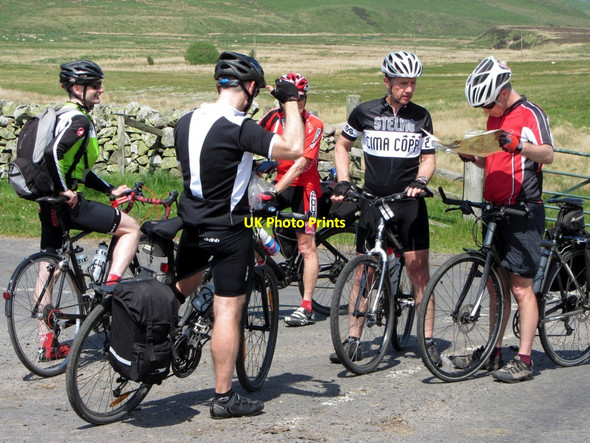 Photo 6"x4" Cyclists discuss the route at road junction near Pennymuir Bridge Chatto c2013