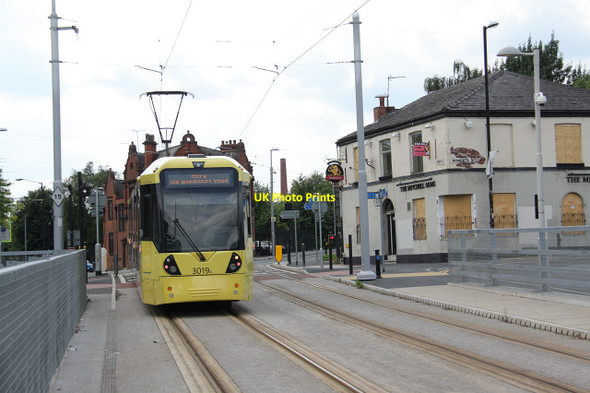 Photo 6"x4" Tram leaving Holt Town stop Manchester c2013