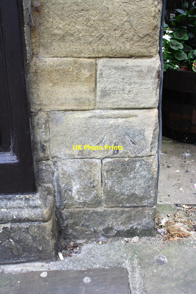 Photo 6"x4" Benchmark on #62 High Street Skipton c2013