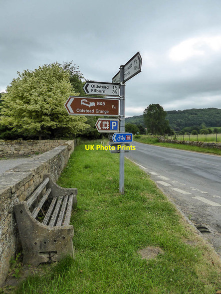 Photo 6"x4" Seat with Signpost near Byland Abbey, Yorkshire Byland Abbey c2014