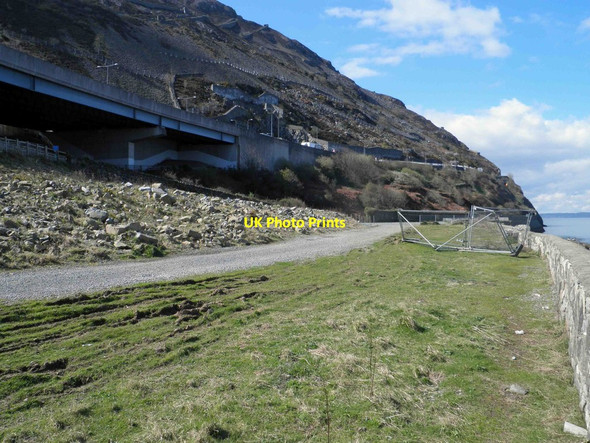 Photo 6"x4" The railway and A55 trunk road above the former Brundrit's Wharf Penmaenmawr c2014