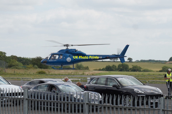 Photo 6"x4" Helicopter takes off at Silverstone Cattle End c2015