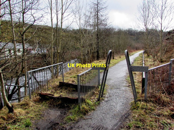 Photo 6"x4" Inwardly-sloping metal barrier at a riverside footpath in Cymmer Cymer c2015