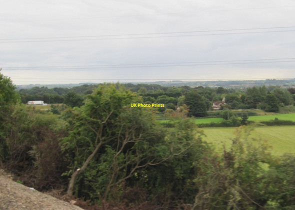 Photo 6"x4" View from a Bristol-Cheltenham train - farmland and woodland near the M4 Pye Corner\/ST6479 c2015