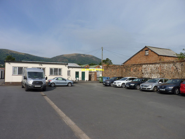 Photo 6"x4" Malvern Hills behind work units at Barnard's Green Great Malvern c2015