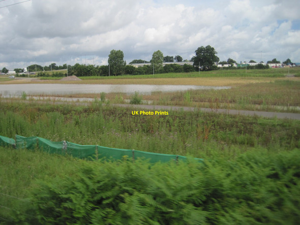 Photo 6"x4" View from a Norwich-Great Yarmouth train - construction work near Postwick Postwick c2016