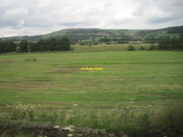Photo 6"x4" View from a Leeds-Skipton train - fields and A629 near Steeton Silsden c2016