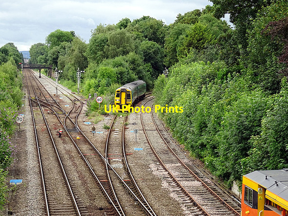 Photo 6"x4" A train from Aberystwyth approaches Sutton Bridge Junction Shrewsbury c2016