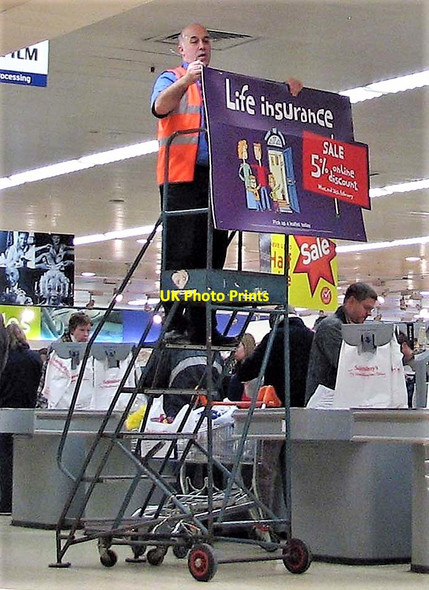 Photo 6"x4" Putting up a sign in Sainsbury's supermarket Hastings\/TQ8110 c2006