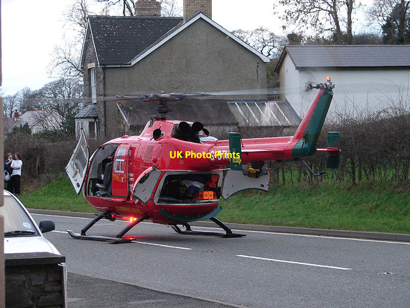 Photo 6"x4" The Air Ambulance lands on the A44 Maes-bangor c2007