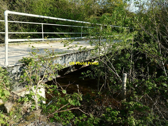 Photo 6"x4" A bridge on the River Yeo, which leads to the Bulldog fish farm, as seen from Downstream Barnstaple c2010