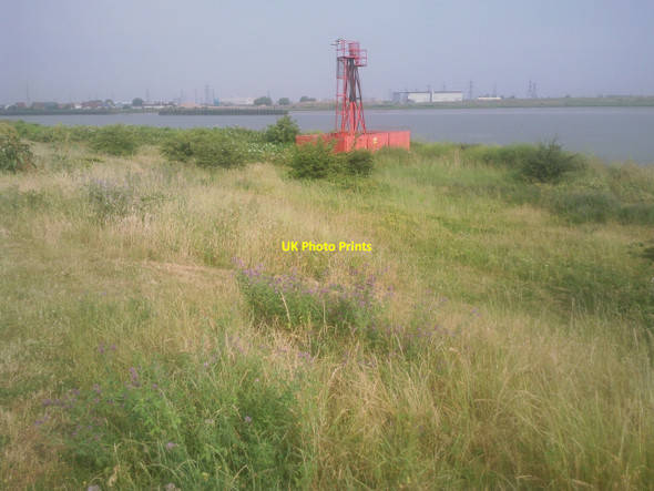 Photo 6"x4" The light at Cross Ness in its setting Thamesmead c2010