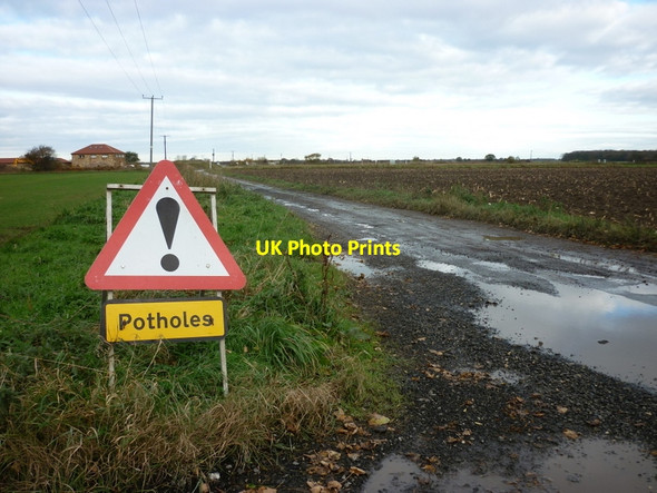 Photo 6"x4" Beware of potholes on Philip Lane, Hambleton Hambleton\/SE5530 c2010
