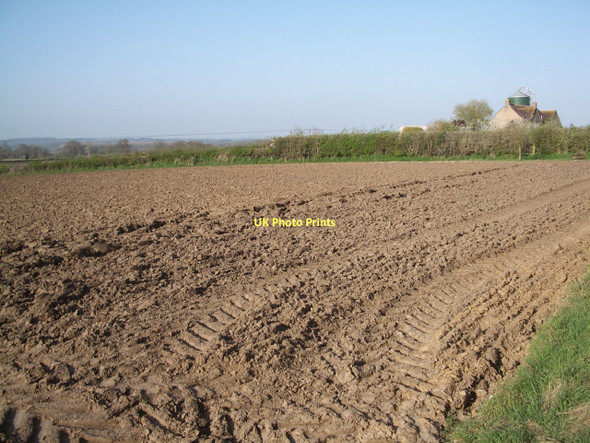 Photo 6"x4" Yetminster: recently ploughed field, with farm and silo Yetminster c2011