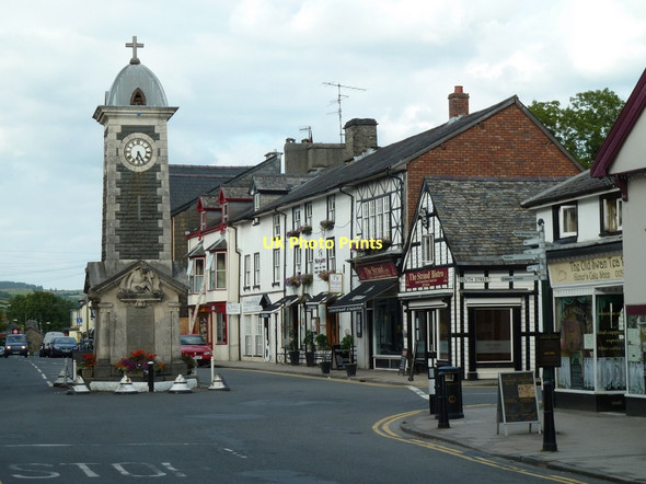 Photo 6"x4" Clock tower and shops, Rhayader Rhayader\/Rhaeadr Gwy c2011