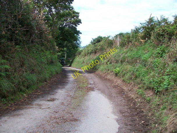 Photo 6"x4" Narrow  and muddy country lane approaching a road junction near Boduan Boduan c2010