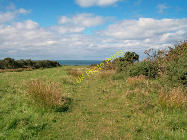 Photo 6"x4" View across open field towards the sea Morfa\/SH1933 c2010
