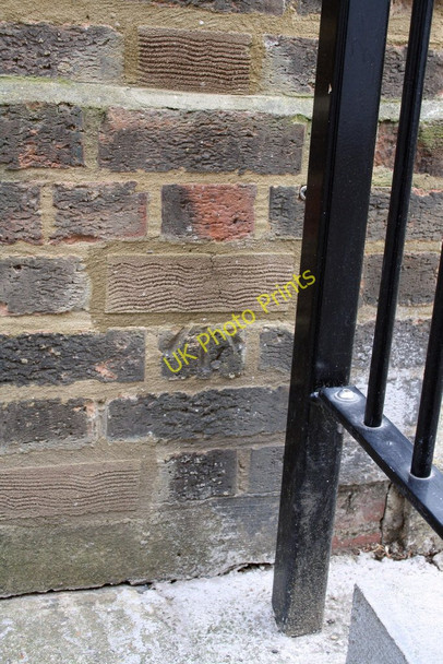 Photo 6"x4" Damaged benchmark on Balfour House, St Charles Square Kensal Town c2011