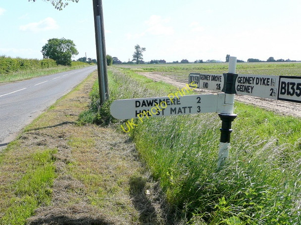 Photo 6"x4" Sign post on the B1359 Sutton Corner c2009
