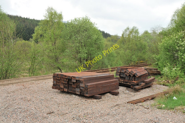 Photo 6"x4" Sleepers stacked next to the West Highland line Achluachrach c2010