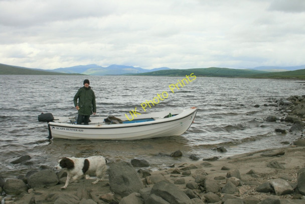 Photo 6"x4" Landing on a rocky shore of Loch  Shin Loch Shin c2010