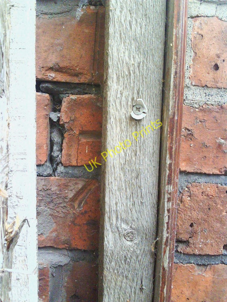 Photo 6"x4" Benchmark hiding behind gatepost at #16 Shadygrove Road Carlisle c2010