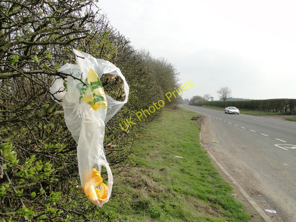 Photo 6"x4" Discarded plastic bag and orange peel on the A140 Banningham c2011