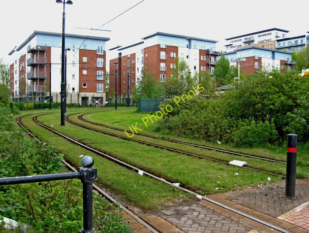 Photo 6"x4" Manchester Metrolink grassed track by Etap Hotel, Salford Quays, Salford Salford\/SJ8098 c2010