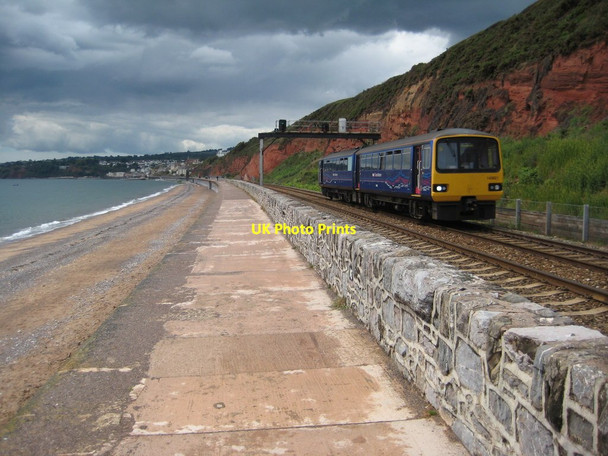Photo 6"x4" Train on the Dawlish sea wall Dawlish c2011