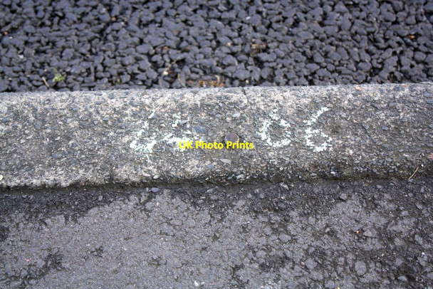 Photo 6"x4" Benchmark  on kerb outside #65 Newmans Lane Loughton\/TQ4396 c2012