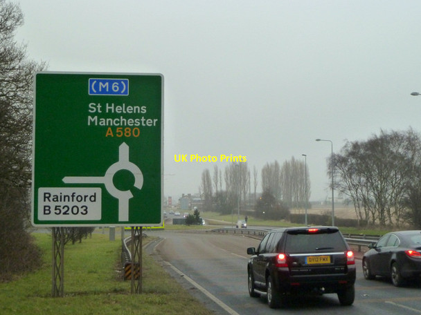 Photo 6"x4" Roundabout sign on A580 East Lancs road Moss Side\/SJ4497 c2015